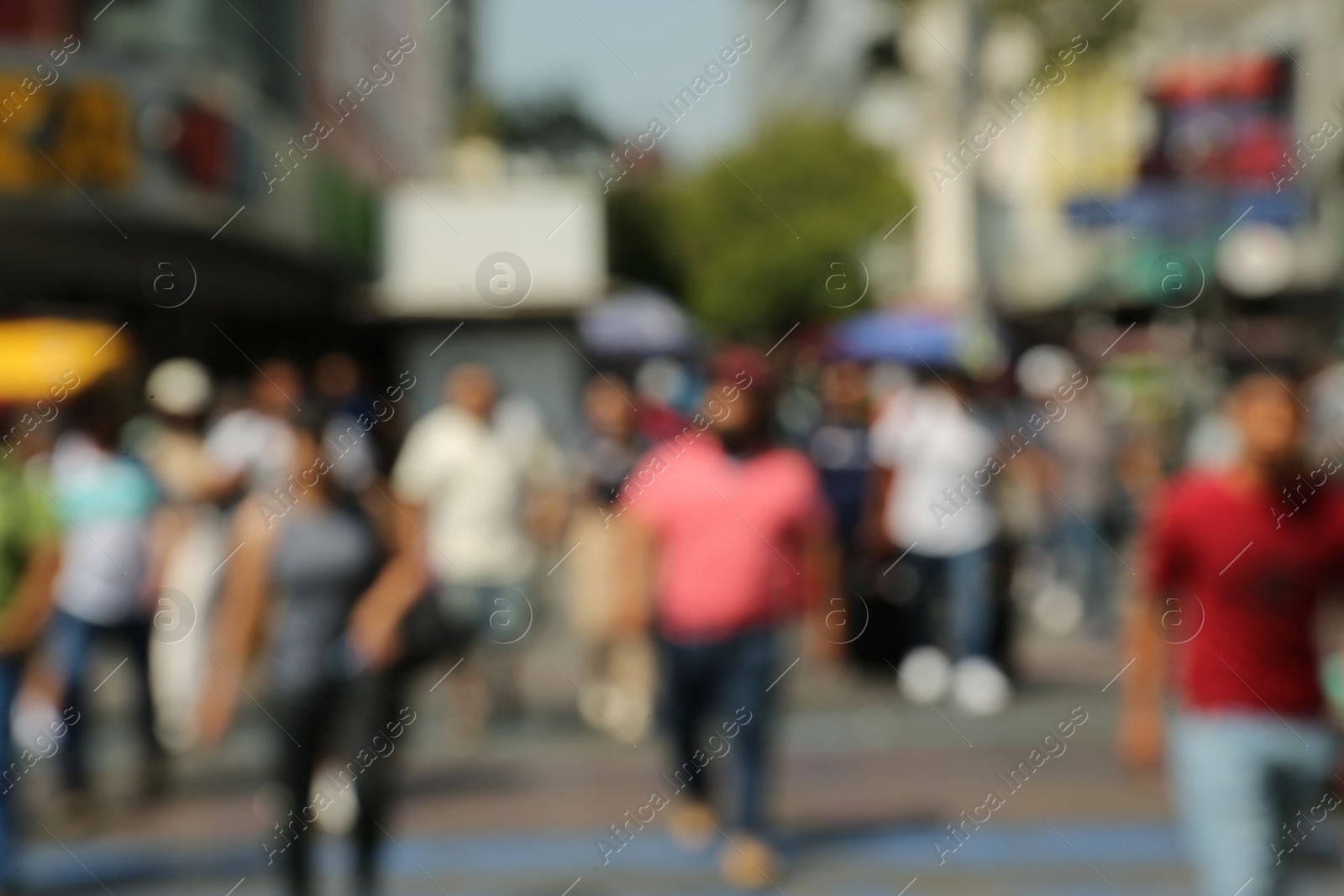 Photo of Blurred view of people on city street