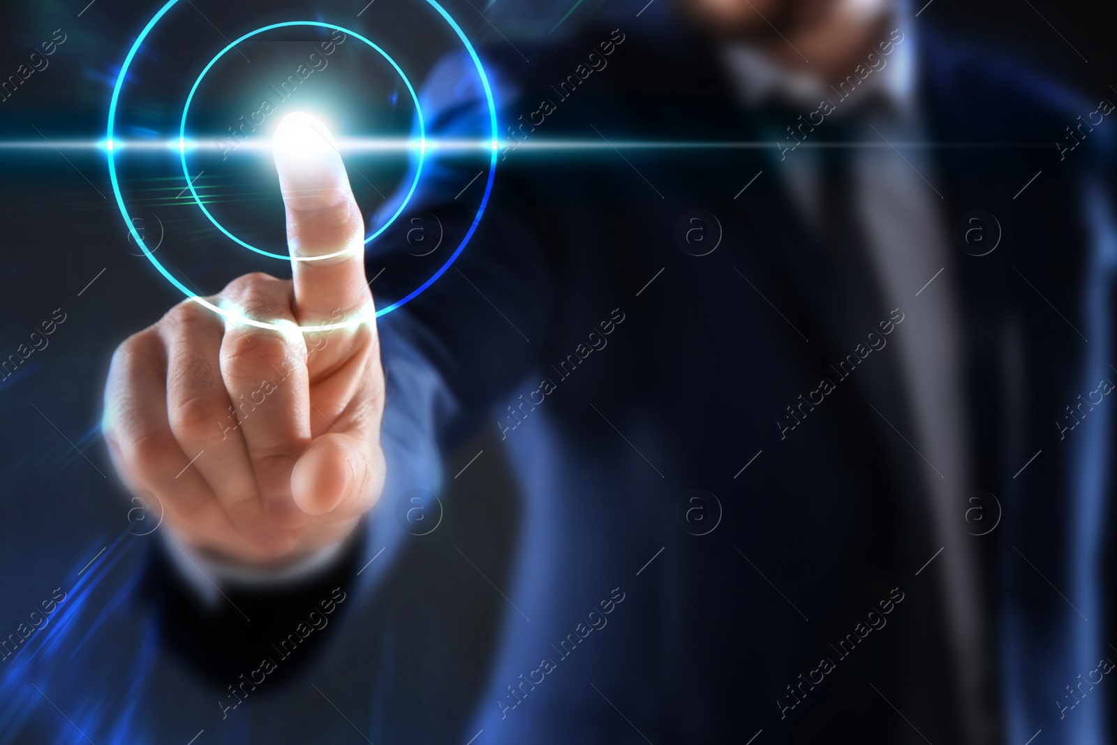 Image of Man pressing button on virtual screen, closeup