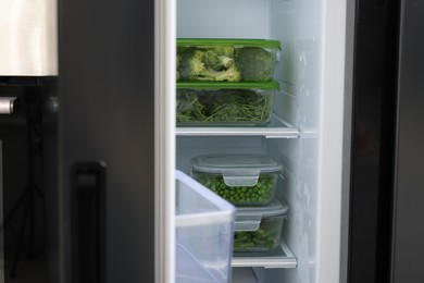 Glass containers with different fresh products in fridge. Food storage