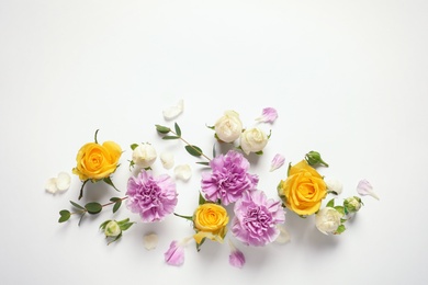 Photo of Flat lay composition with beautiful blooming flowers on white background