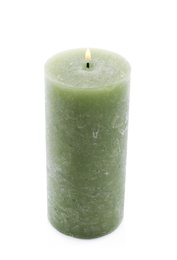 Photo of Burning green wax candle isolated on white