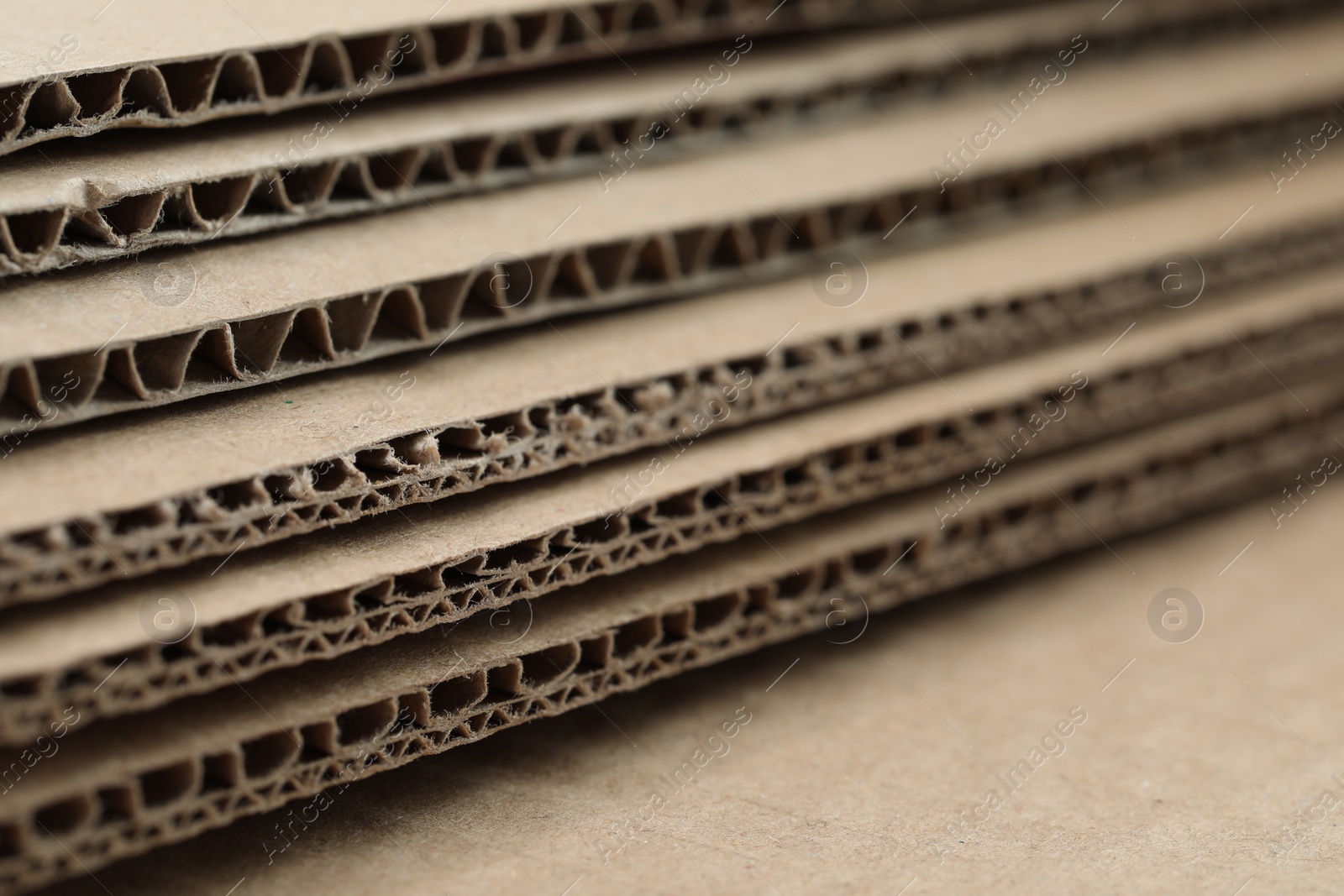 Photo of Sheets of brown corrugated cardboard, closeup view