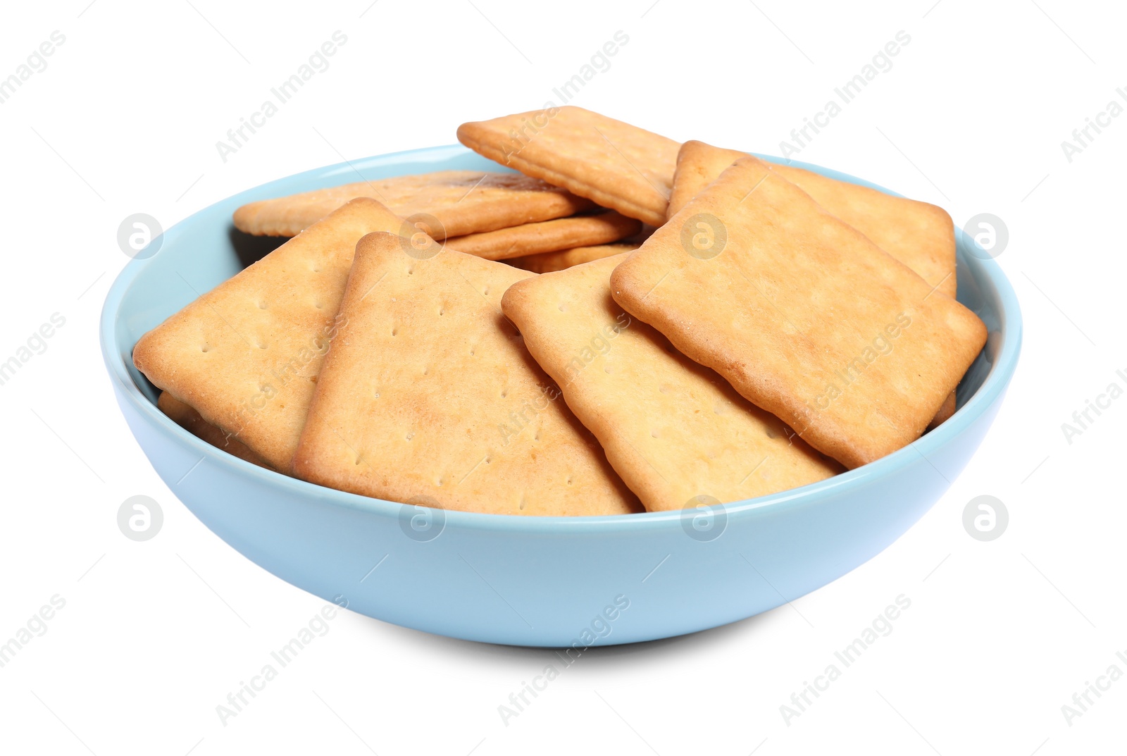 Photo of Tasty crackers in bowl isolated on white