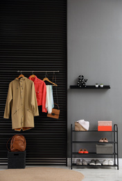 Hallway interior with stylish furniture, clothes and accessories