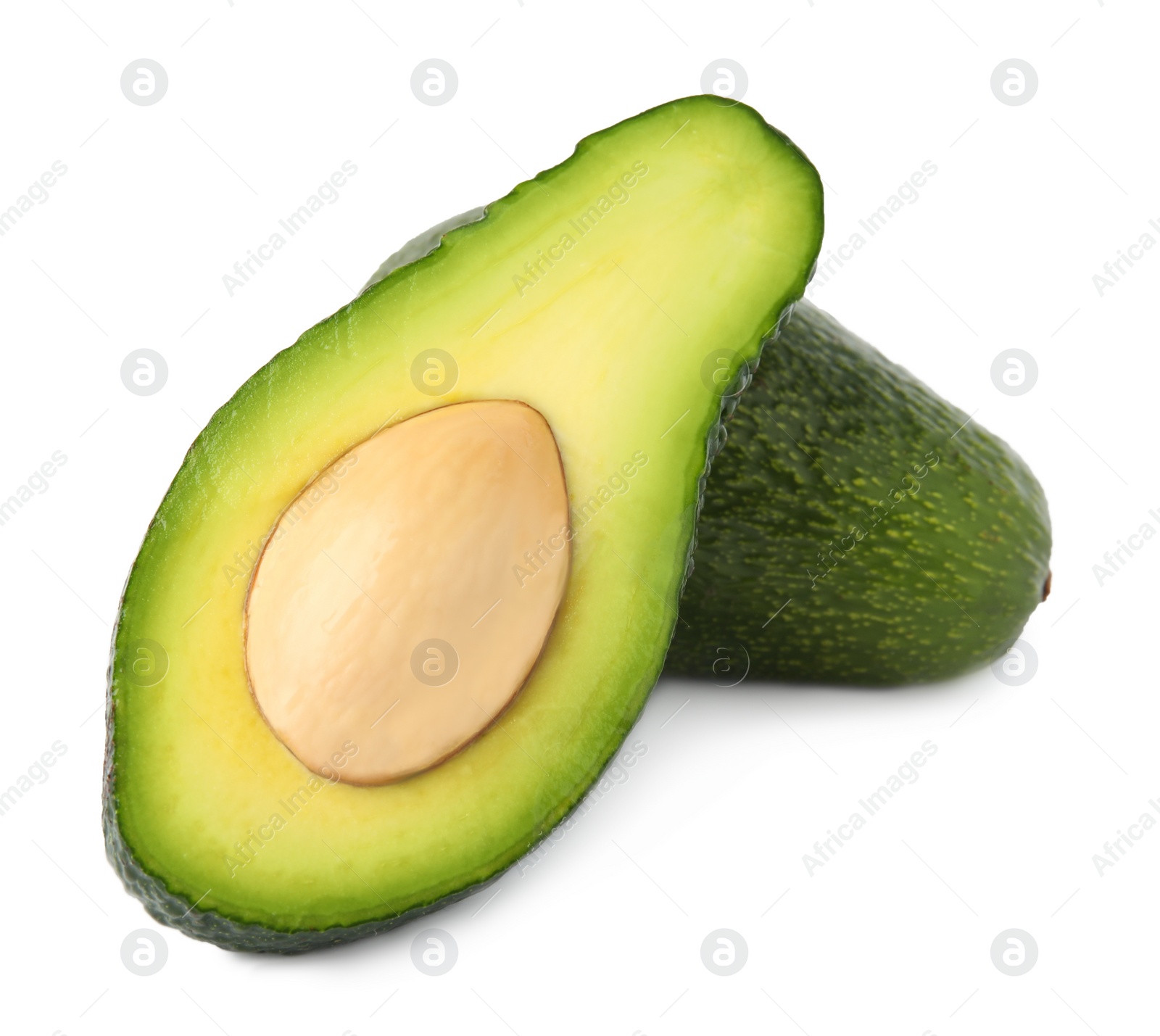 Photo of Tasty ripe avocados on white background. Tropical fruit