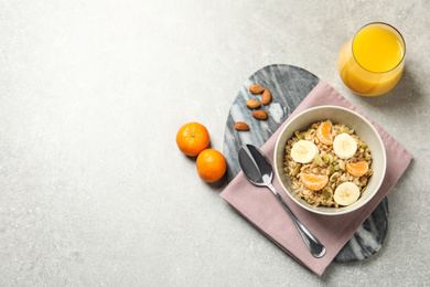 Tasty healthy breakfast served on light grey table, flat lay. Space for text