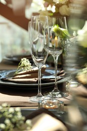 Festive table setting with beautiful tableware and floral decor