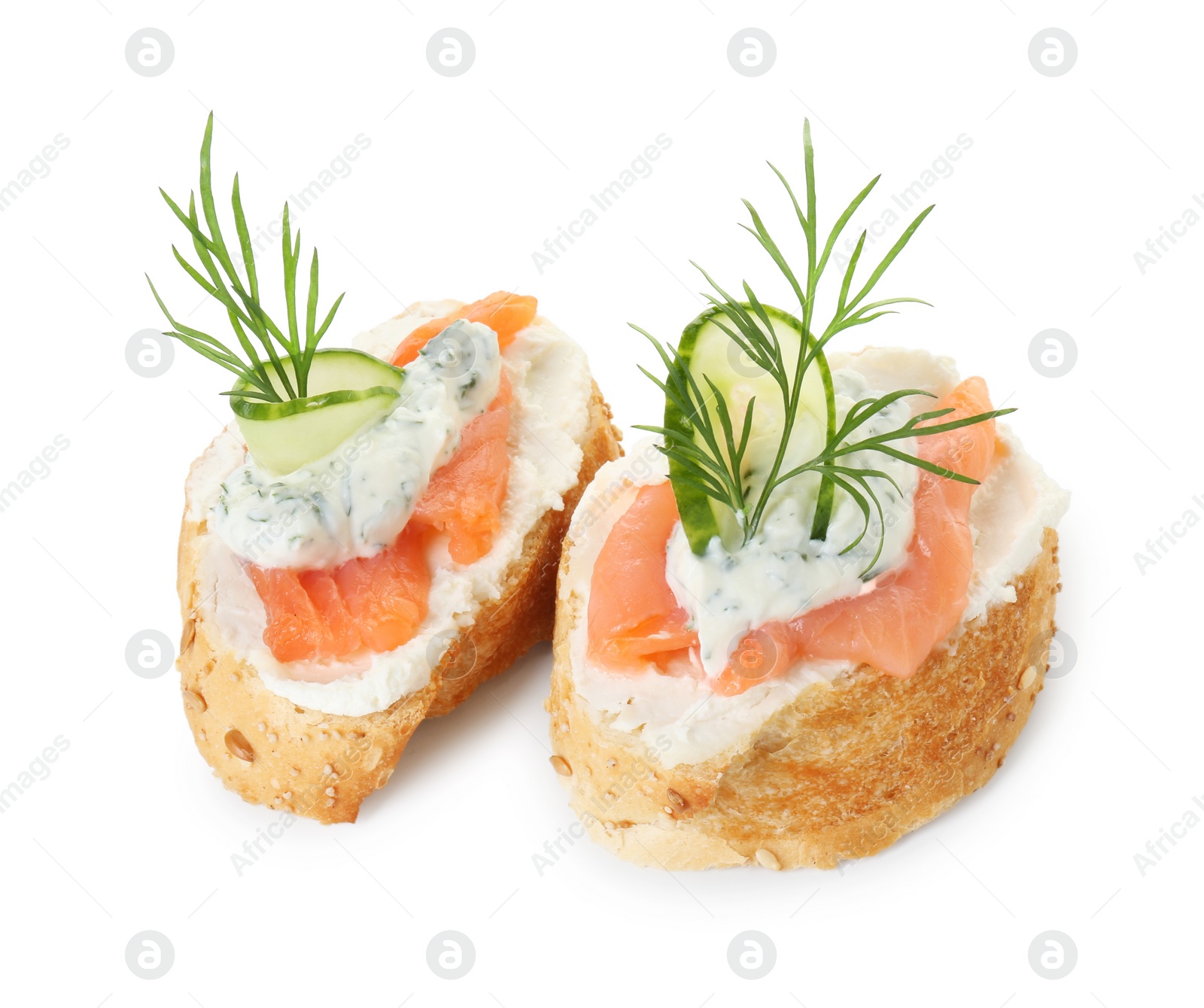 Photo of Tasty canapes with salmon, cucumber, cream cheese and dill isolated on white