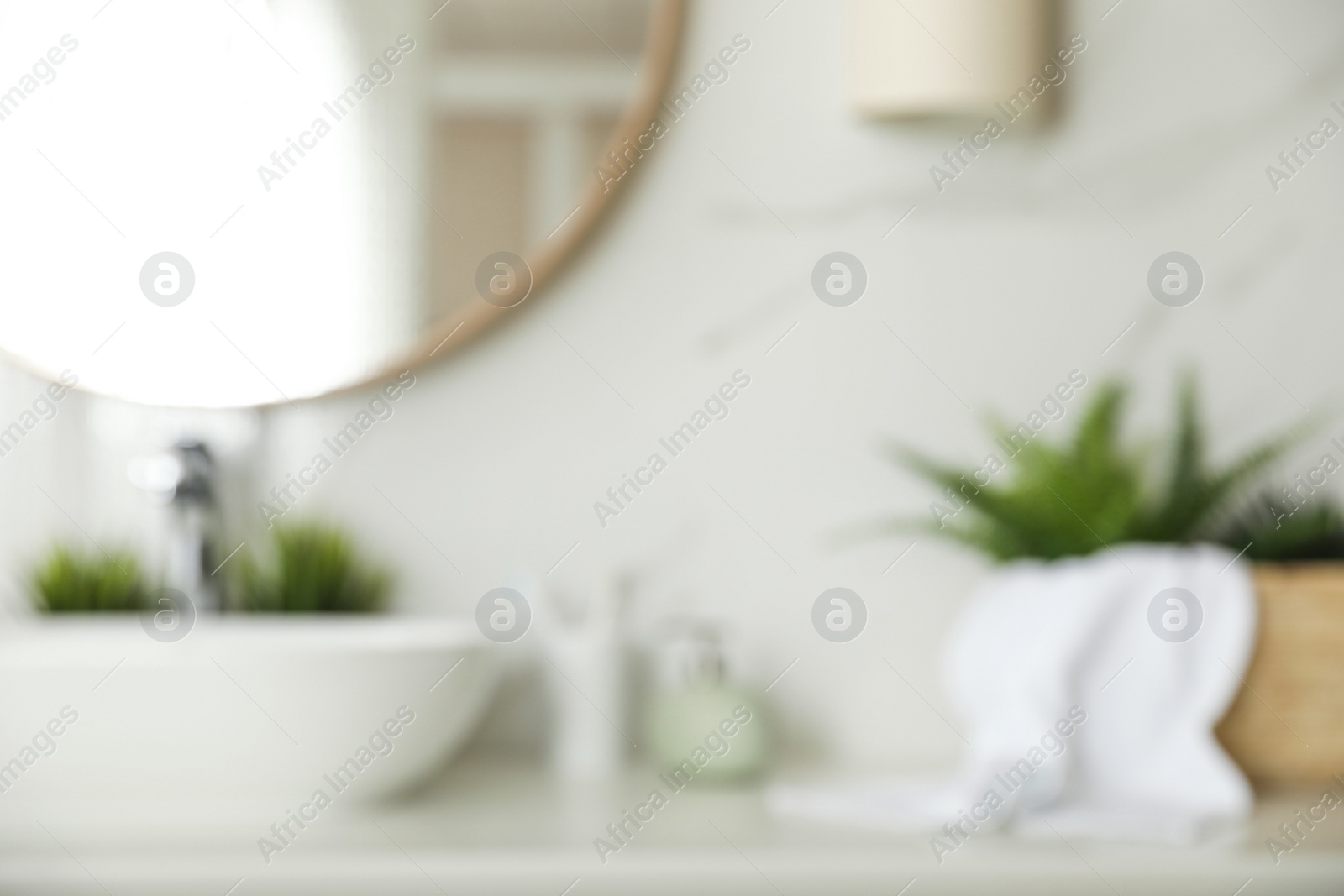 Photo of Blurred view of stylish modern bathroom with mirror