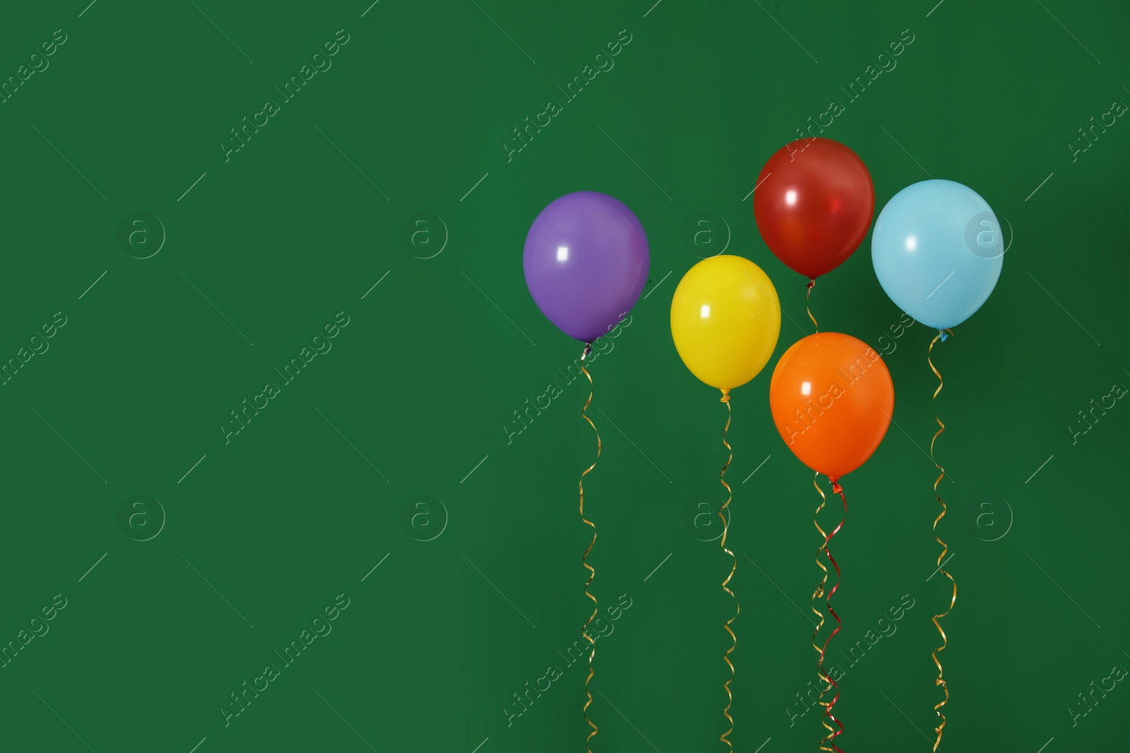 Photo of Bright balloons on color background, space for text. Celebration time