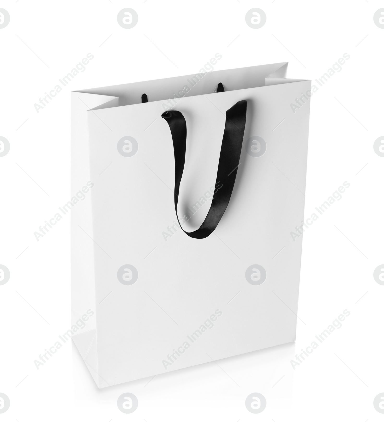 Photo of Paper shopping bag isolated on white. Mock up for design