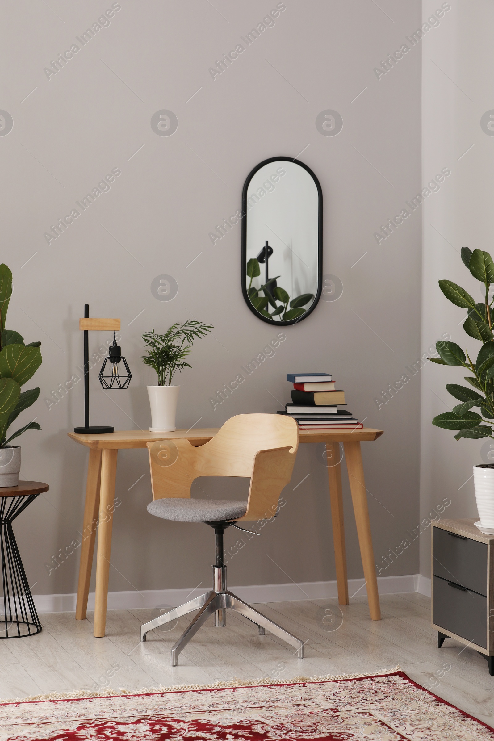 Photo of Cozy room interior with stylish furniture, houseplants and decor elements