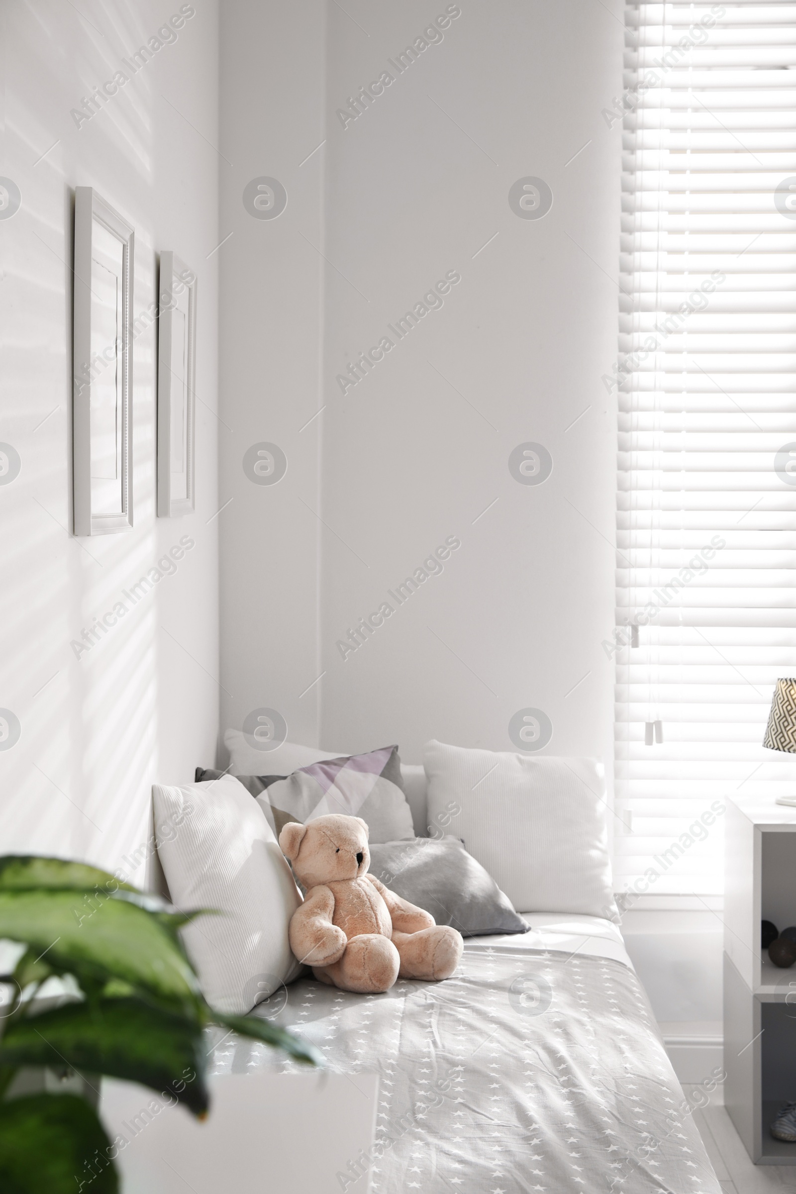 Photo of Modern child room interior with comfortable bed