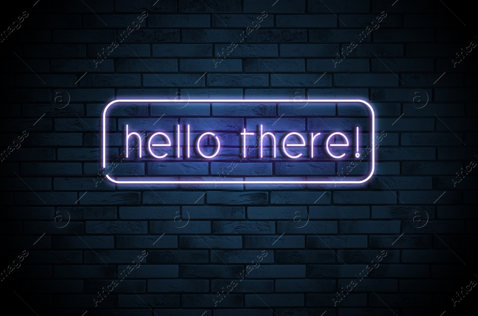 Image of Stylish neon sign with phrase Hello there on brick wall