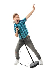 Photo of Cute boy singing in microphone on white background