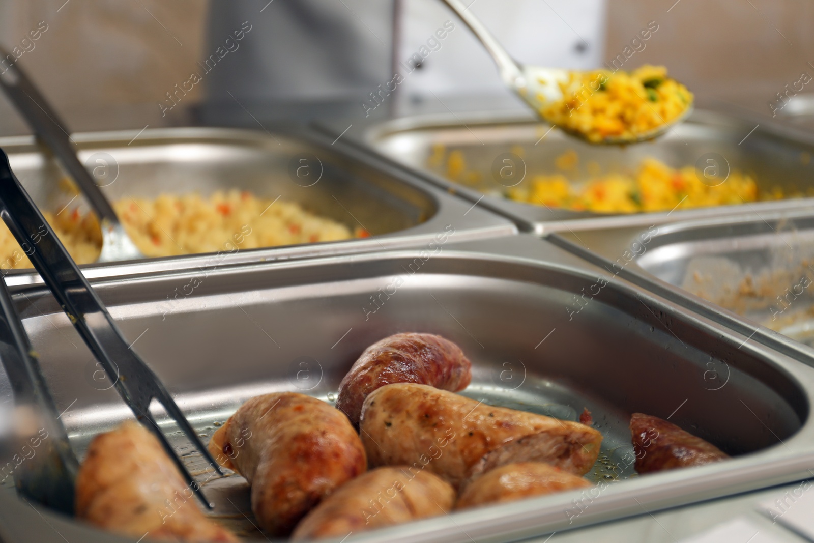 Photo of Containers with tasty food in school canteen