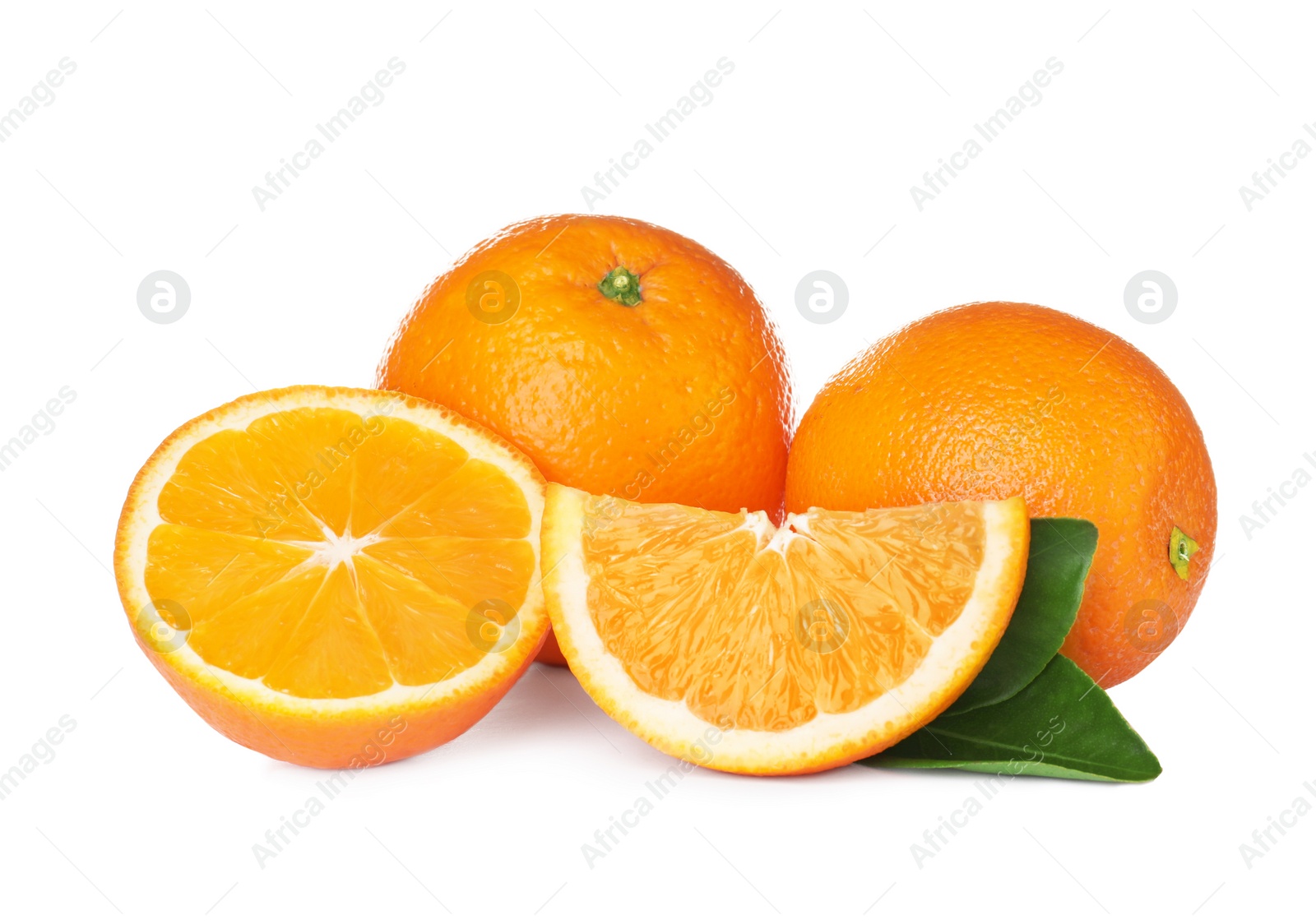 Photo of Fresh ripe oranges with leaves isolated on white