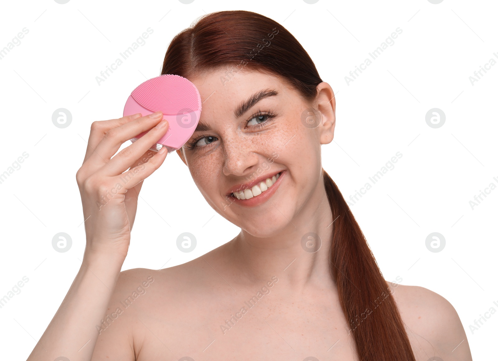 Photo of Washing face. Young woman with cleansing brush on white background