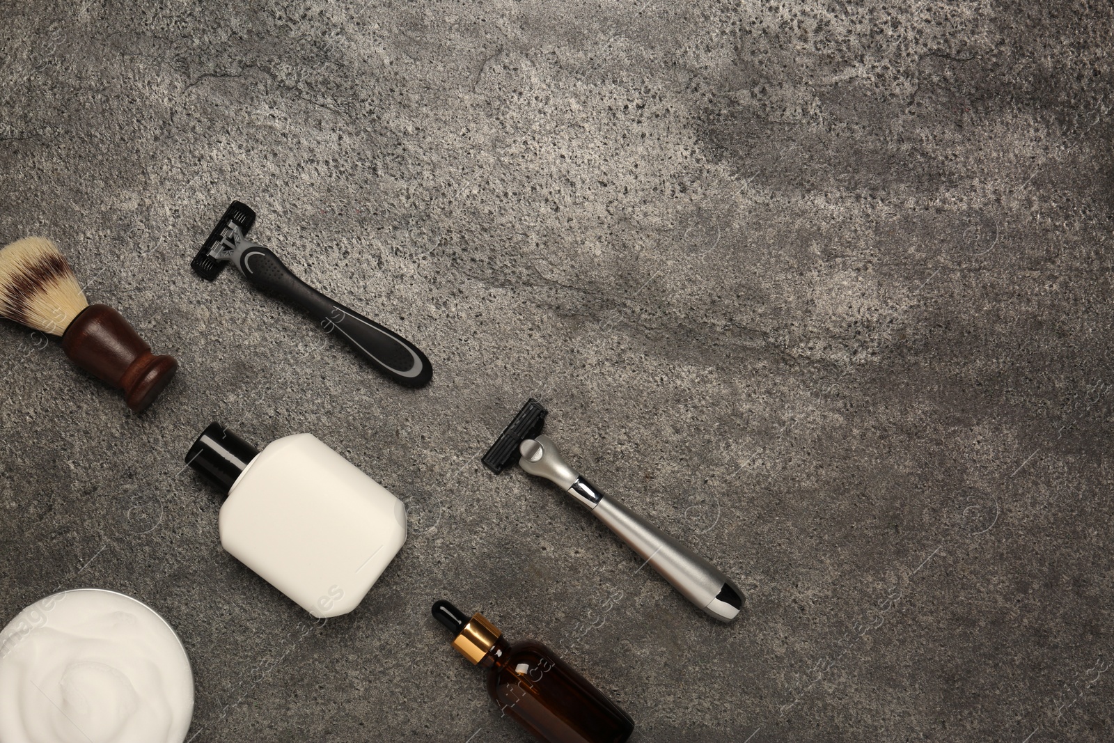 Photo of Flat lay composition with shaving accessories for men on grey table. Space for text