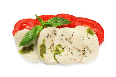 Photo of Tasty salad Caprese with mozzarella, tomatoes, basil and pesto sauce isolated on white, top view