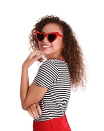 Young beautiful African-American woman wearing heart shaped glasses on white background