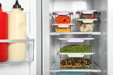 Photo of Open refrigerator full of different fresh products