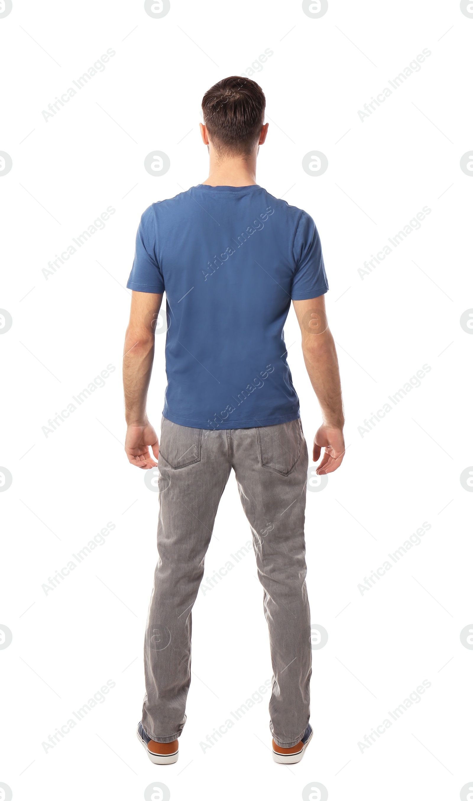 Photo of Young man in casual clothes posing on white background