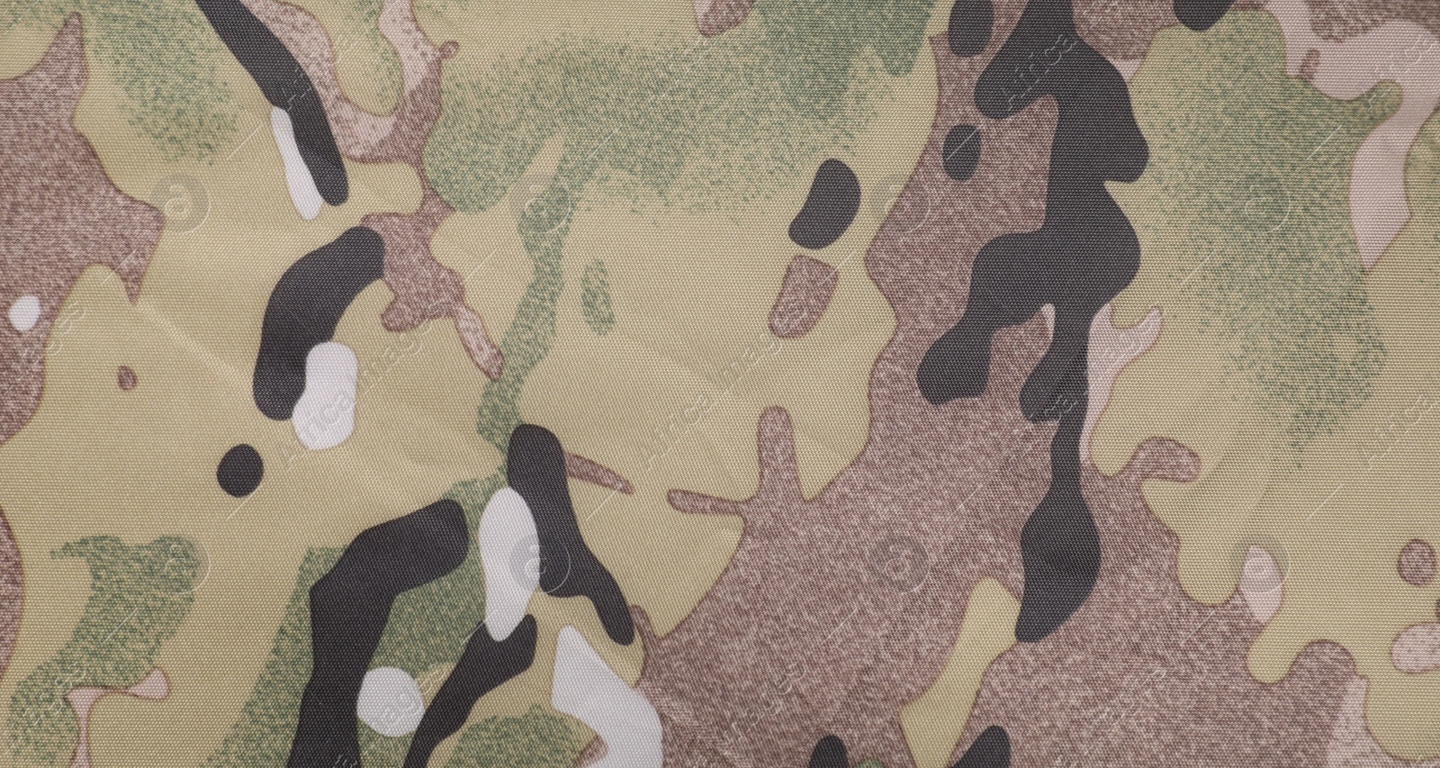 Photo of Texture of camouflage fabric as background, top view