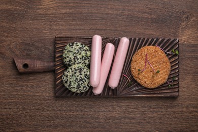 Photo of Different vegan products on wooden table, top view
