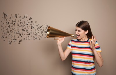 Woman using megaphone on d bark beige background. Letters flying out of device