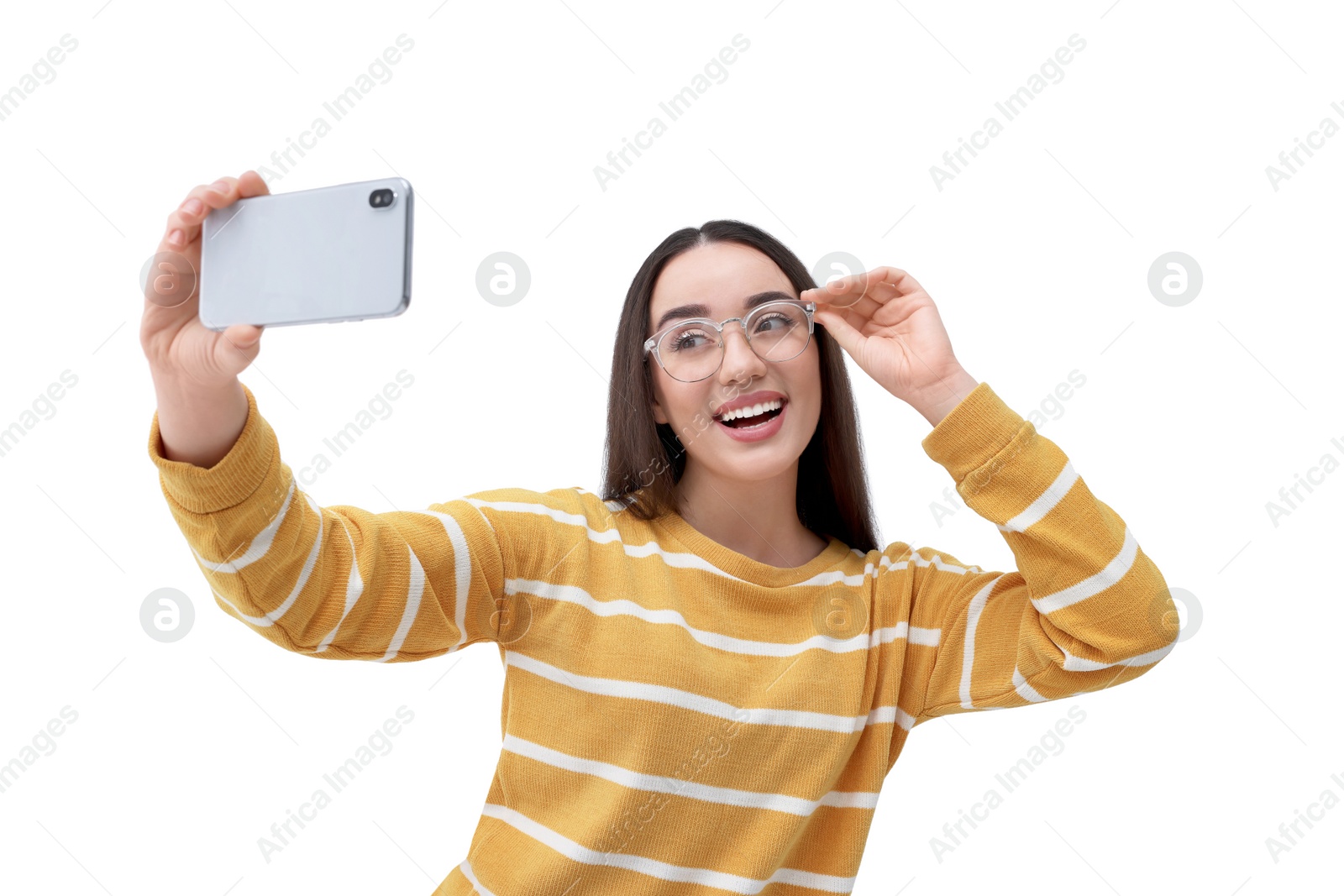 Photo of Smiling young woman taking selfie with smartphone on white background