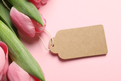 Photo of Happy Mother's Day. Beautiful flowers with blank card on pink background, closeup