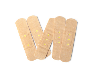 Photo of Medical sticking plasters isolated on white. First aid item