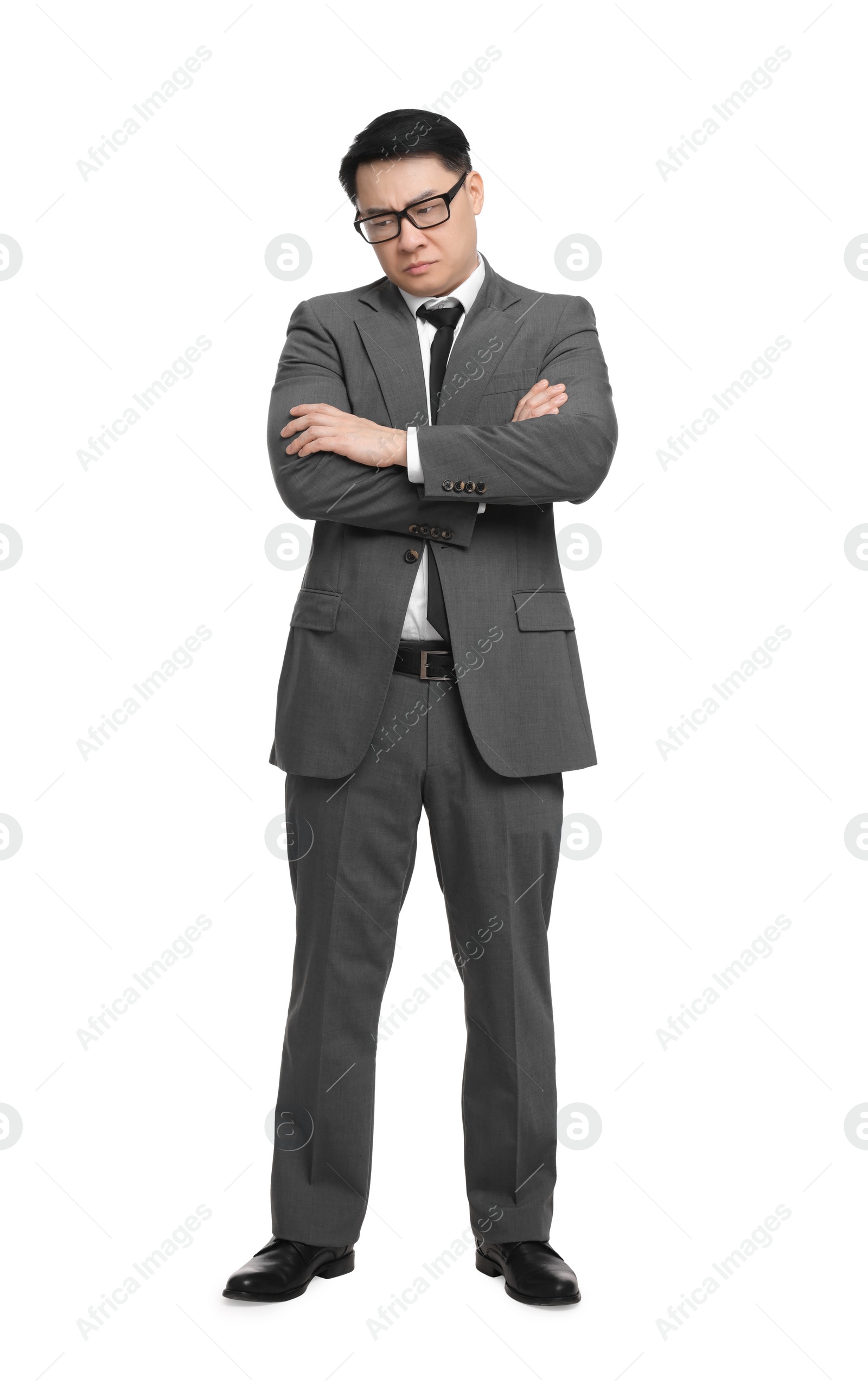 Photo of Angry businessman in suit wearing glasses on white background