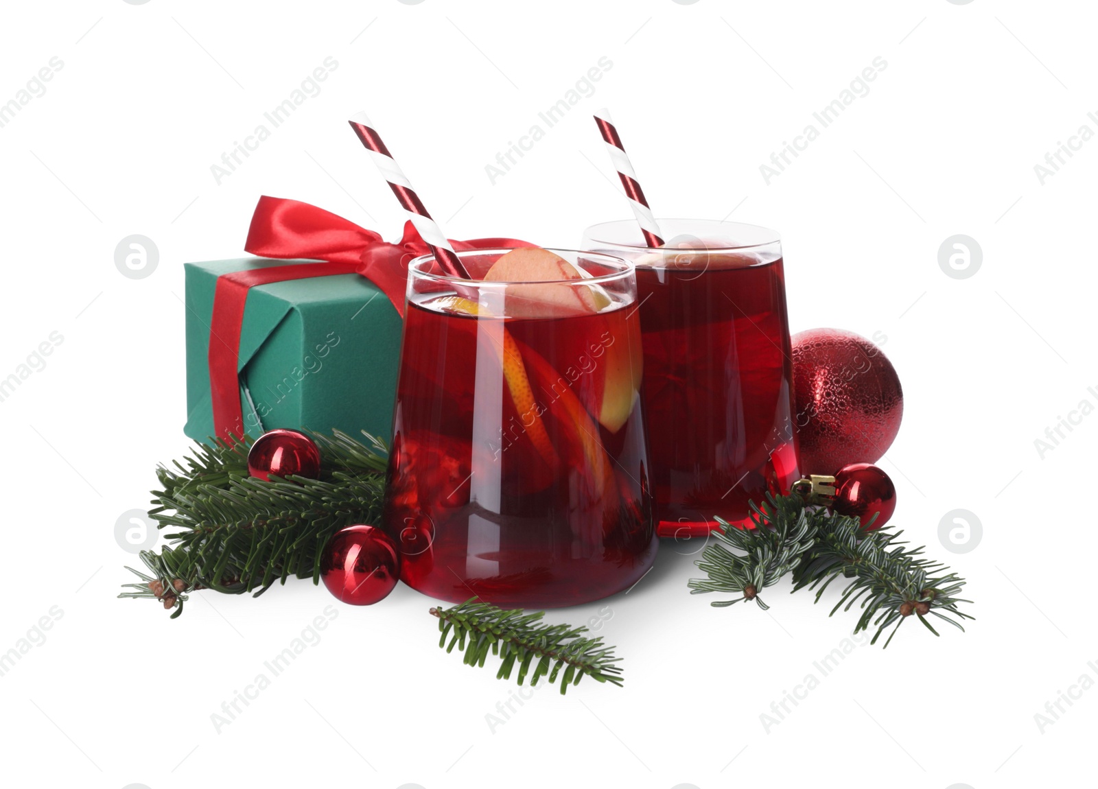 Photo of Delicious Sangria drink in glasses and Christmas decorations on white background