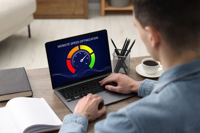 Image of Website speed optimization. Man using laptop at table, closeup