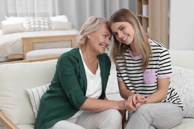 Young woman with her mom at home. Happy Mother's Day