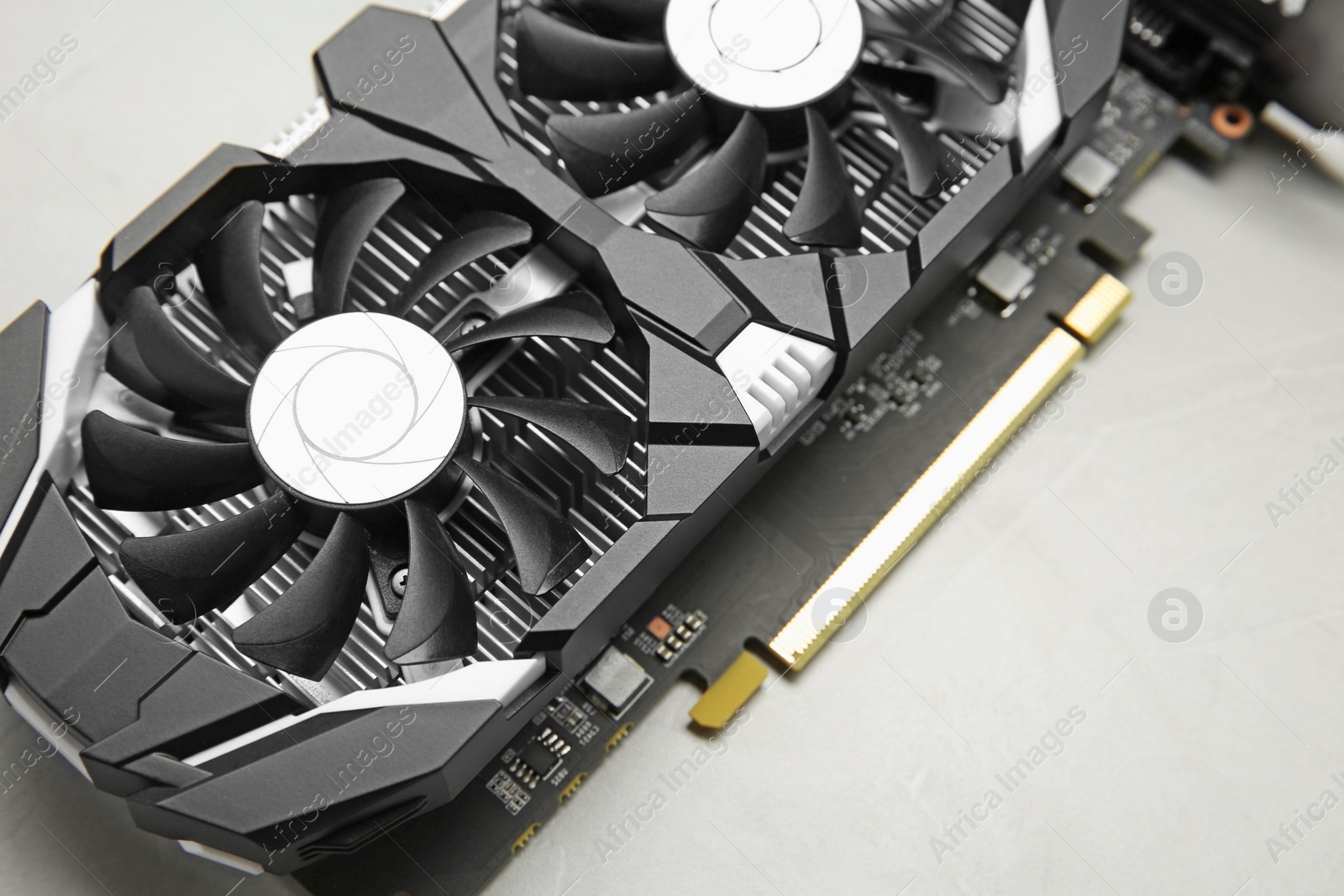 Photo of Computer graphics card on gray textured background, above view