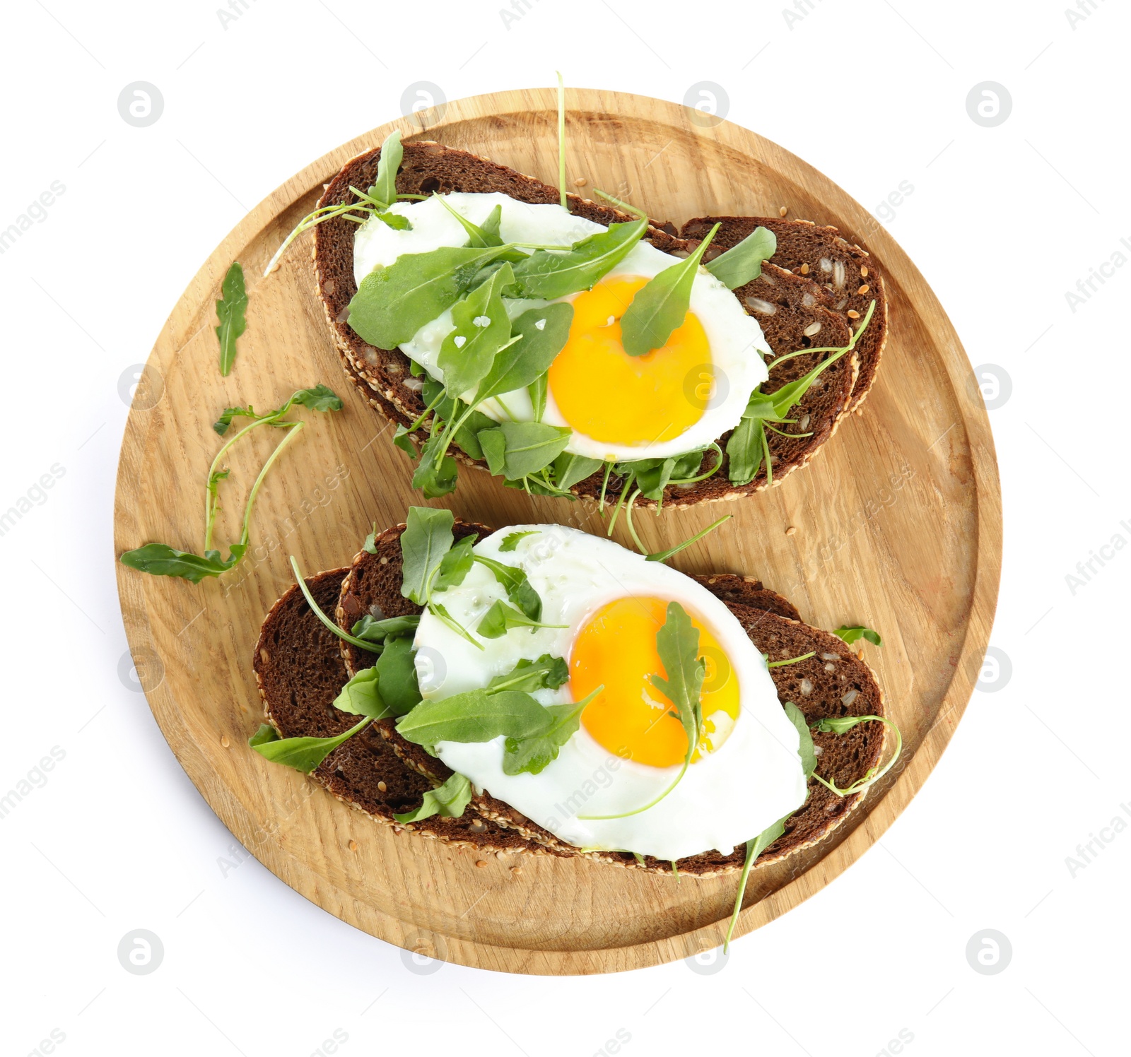 Photo of Delicious sandwiches with arugula and fried egg isolated on white, top view