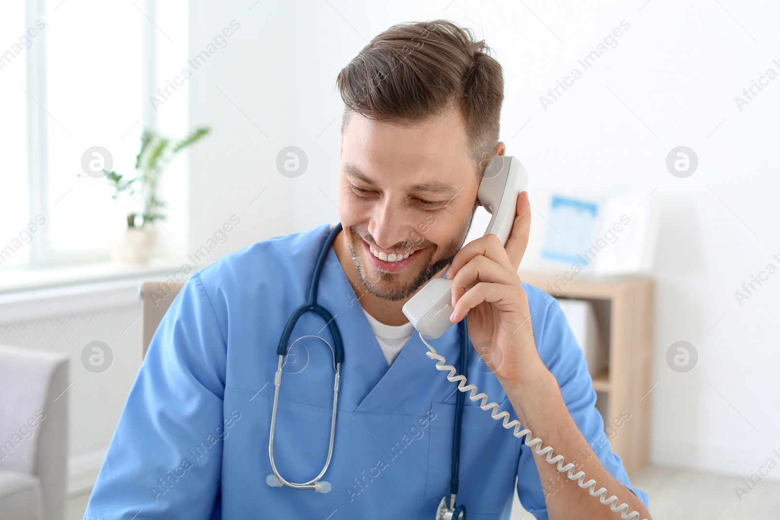 Photo of Male medical assistant in clinic. Health care service