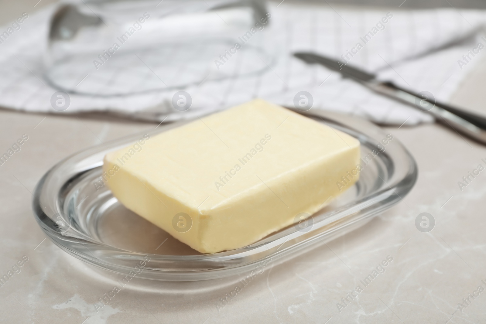 Photo of Plate with tasty fresh butter on table