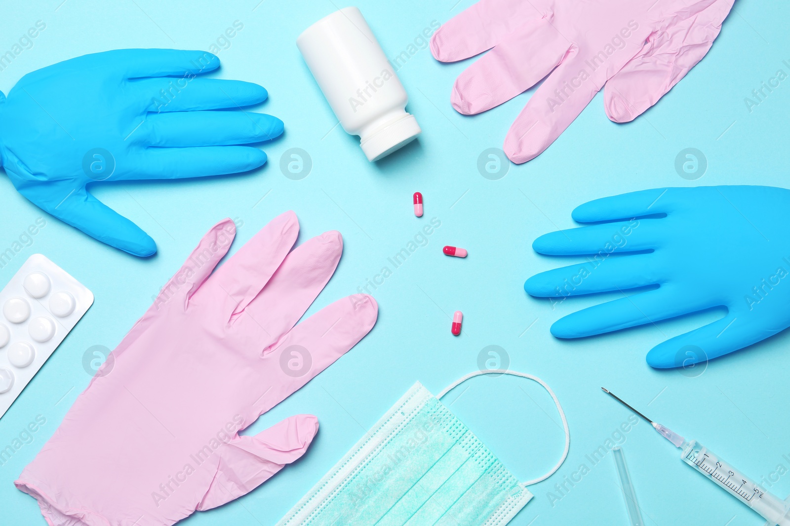 Photo of Flat lay composition with medical gloves on color background