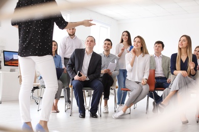 Female business trainer giving lecture in office