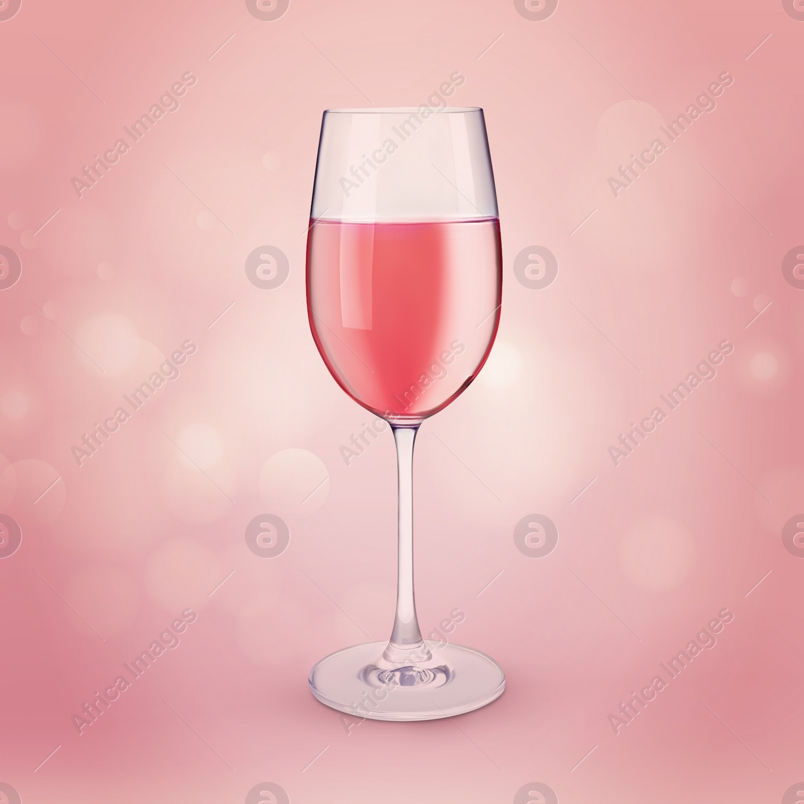 Image of Glass of expensive rose wine on pink background