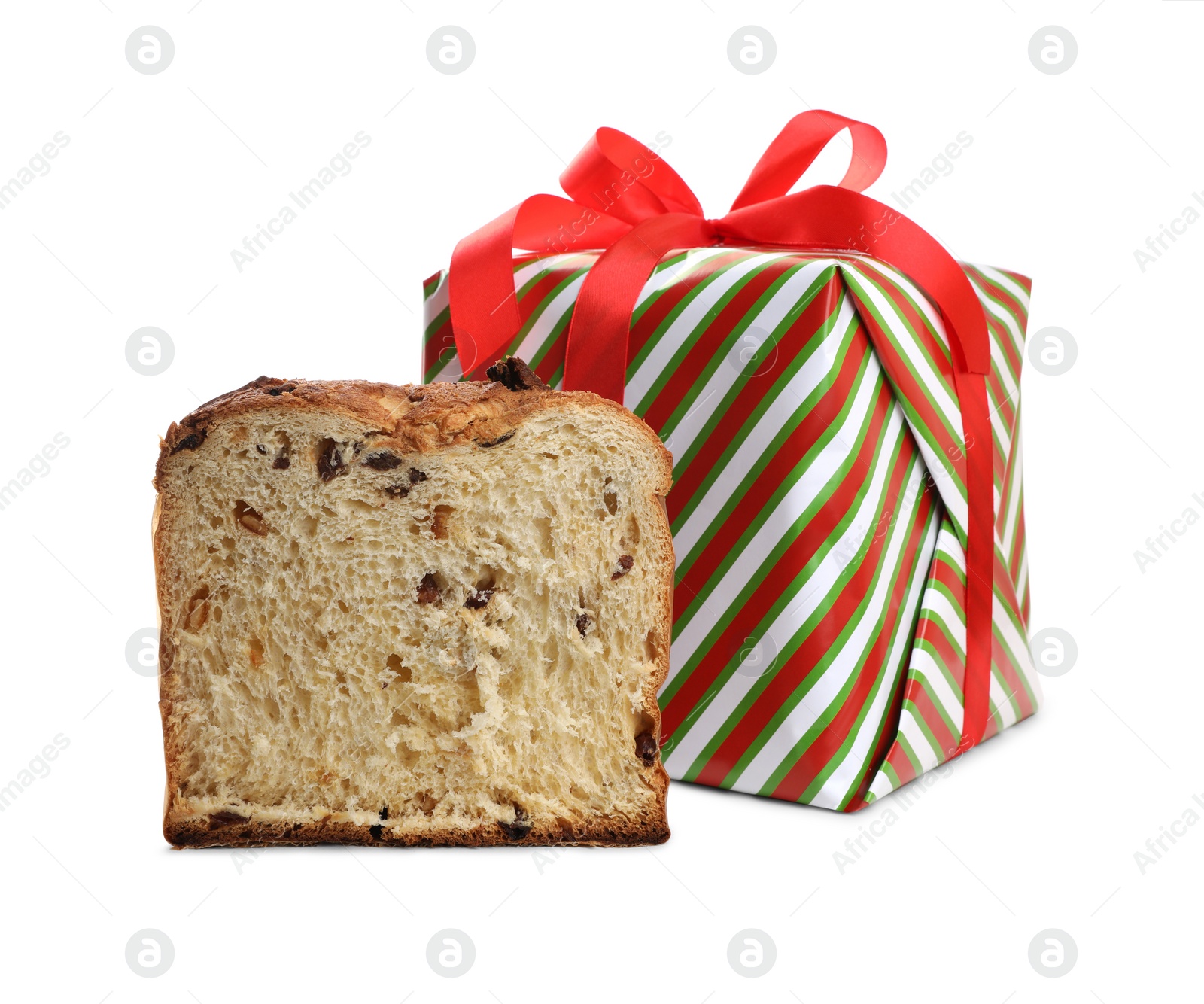 Photo of Half of delicious Panettone cake and gift box on white background. Traditional Italian pastry