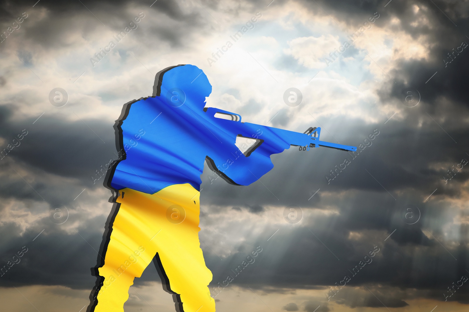 Image of Silhouette of soldier in color of Ukrainian flag with assault rifle against cloudy sky