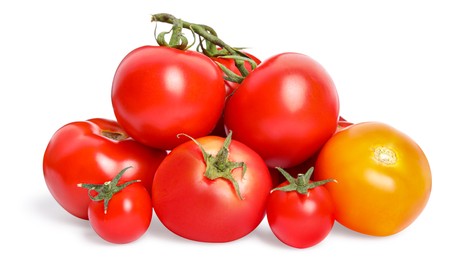 Many different ripe tomatoes on white background