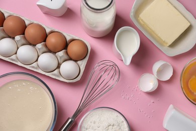 Photo of Flat lay composition with whisk and dough in bowl on pink background