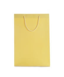 Yellow paper shopping bag isolated on white