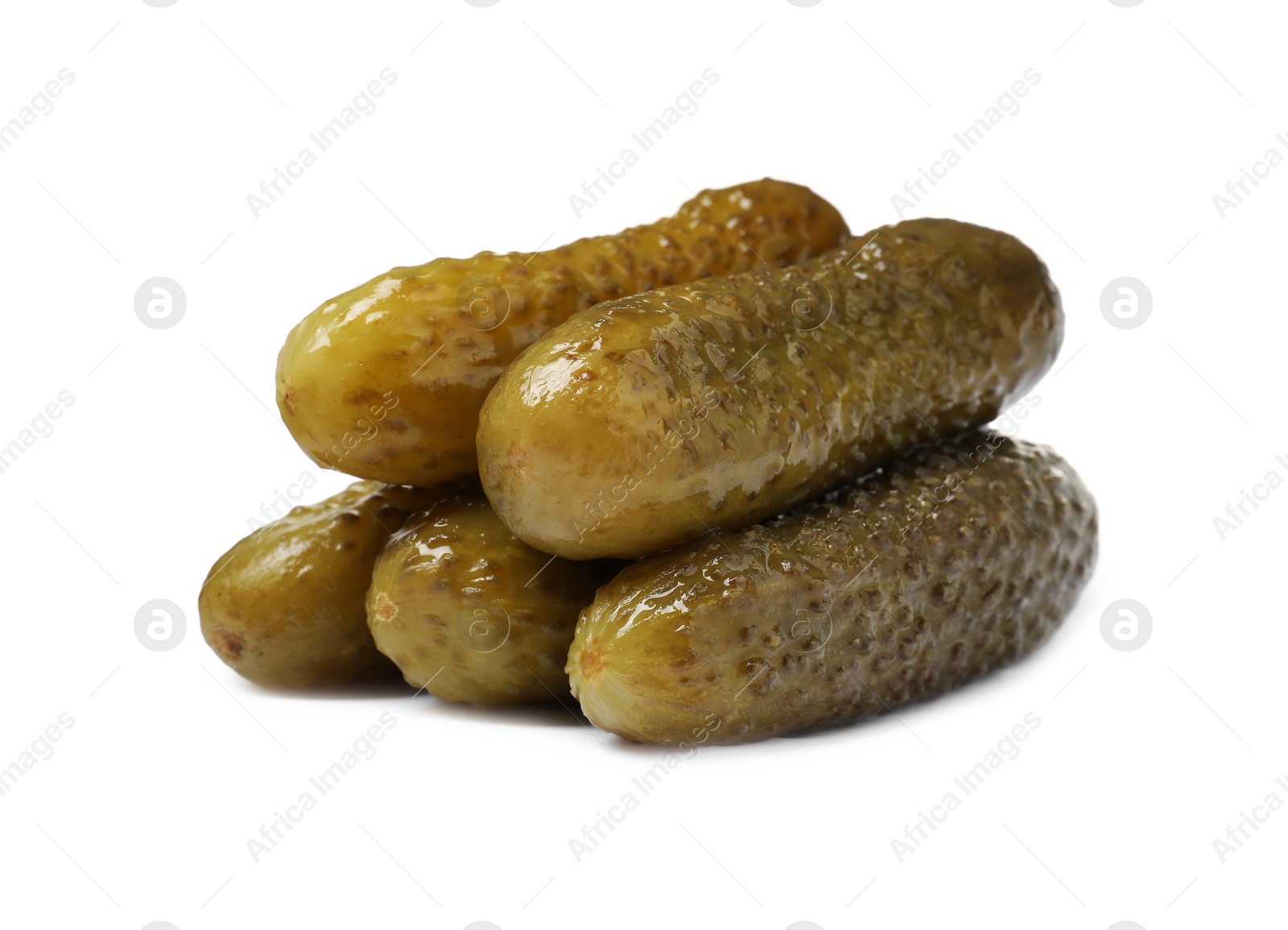 Photo of Pile of tasty pickled cucumbers isolated on white